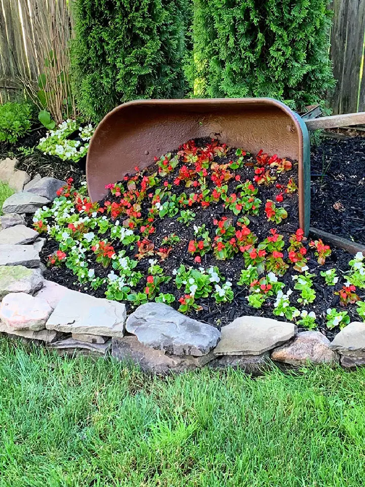 15 Amazing Wooden Wheelbarrow Planter Ideas